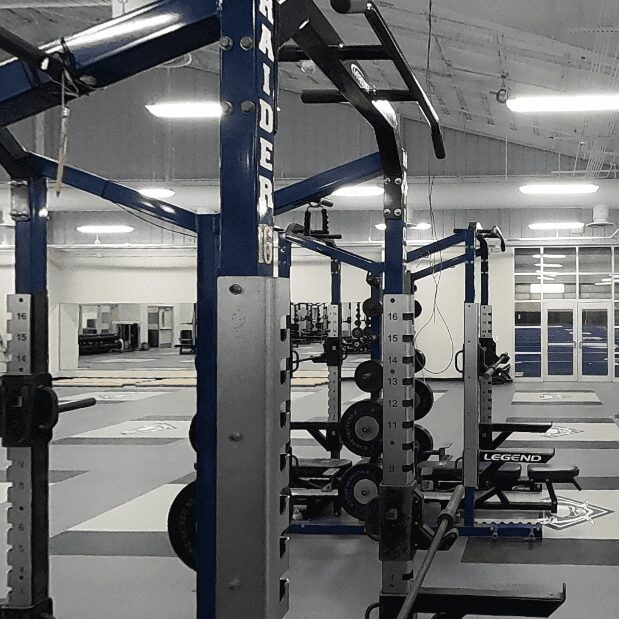 Gym equipment in a spacious workout area.